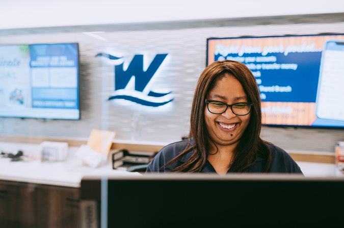 Tanesha at computer smiling